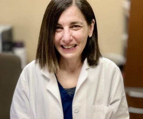 Dr. Barbi Kaplan-Frenkel with cake