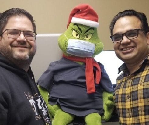 Dr. Kamal Abbi and Dr. Brad Heraly with Grinch